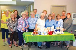 members of the Harrowsmith Women's Institute with some of the results of their own Teddy Bear and Quincy Project.